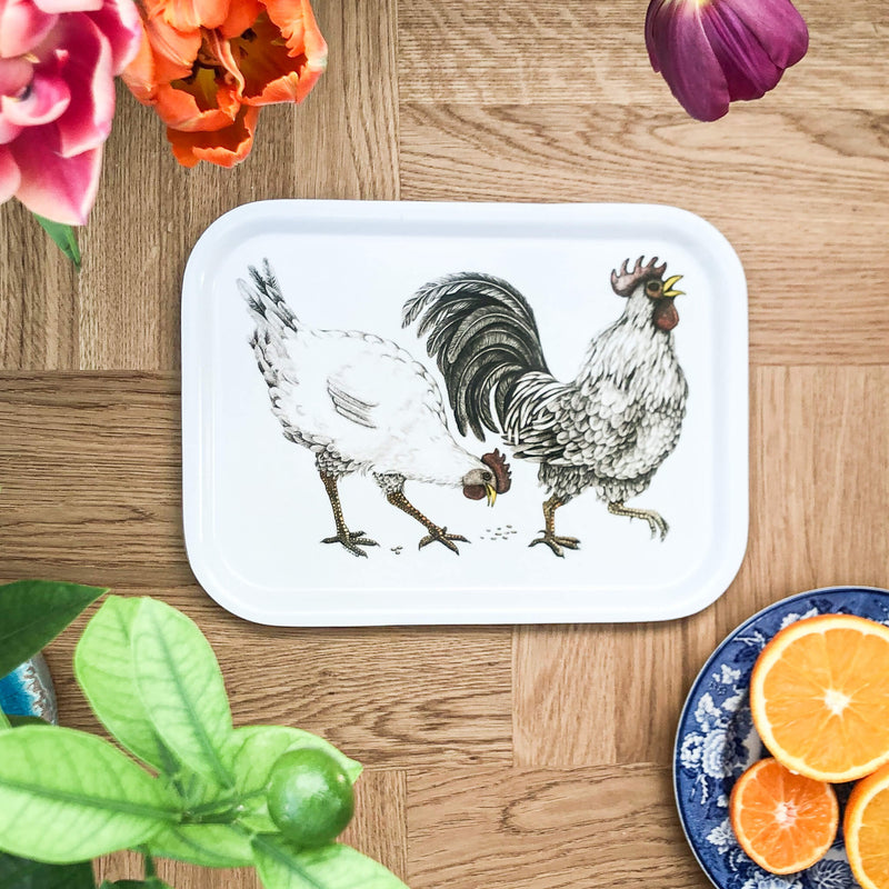rooster and hen on wooden tray