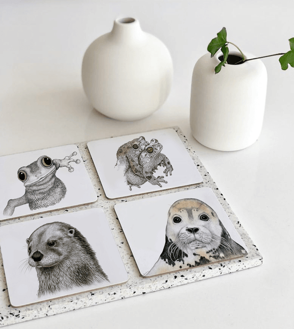 coasters with frog, seal and seaotter motifs